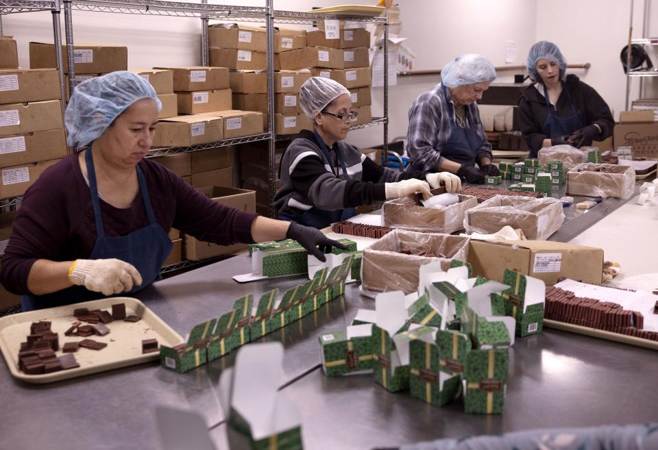 Chocolate sandwiches are hand packed into boxes at Fernwood Candy Company in Logan on Thursday, Nov. 30, 2023. | Laura Seitz, Deseret News