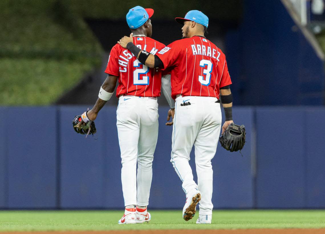 Miami Marlins center fielder Jazz Chisholm Jr. (2) and second baseman Luis Arraez (3) make their way back to the field against the Milwaukee Brewers in the sixth inning of an MLB game at loanDepot park on Saturday, Sept. 23, 2023, in Miami, Fla.