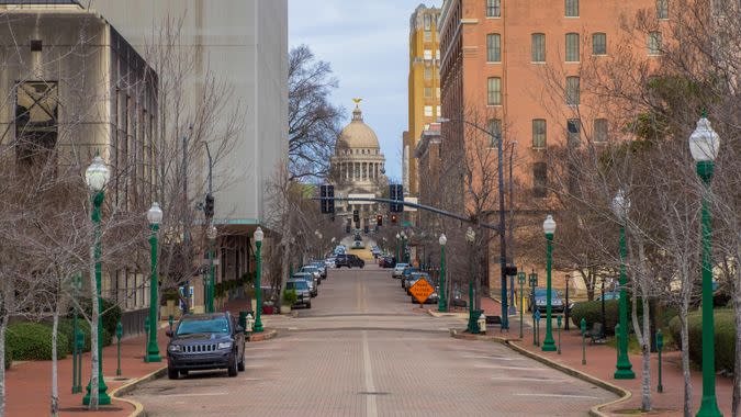 Downtown street in Jackson, Mississippi with the state capitol building.