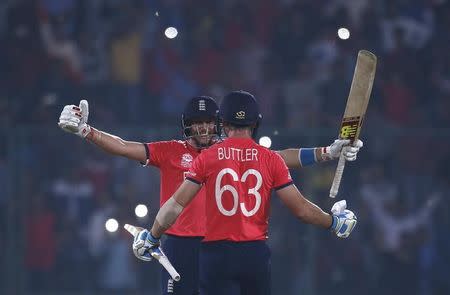 Cricket - England v New Zealand - World Twenty20 cricket tournament semi-final - New Delhi, India - 30/03/2016. England's Joe Root (L) and Jos Buttler celebrate after winning their match. REUTERS/Adnan Abidi