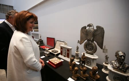Argentine Security Minister Bullrich looks at Nazi artefacts before a news conference at the Holocaust museum in Buenos Aires