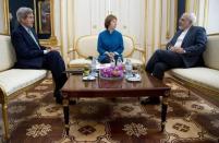 (L-R) U.S. Secretary of State John Kerry, European Union Foreign Policy Chief Catherine Ashton, and Iran's Foreign Minister Mohammad Javad Zarif are photographed as they participate in a trilateral meeting in Vienna October 15, 2014. REUTERS/Carolyn Kaster/Pool