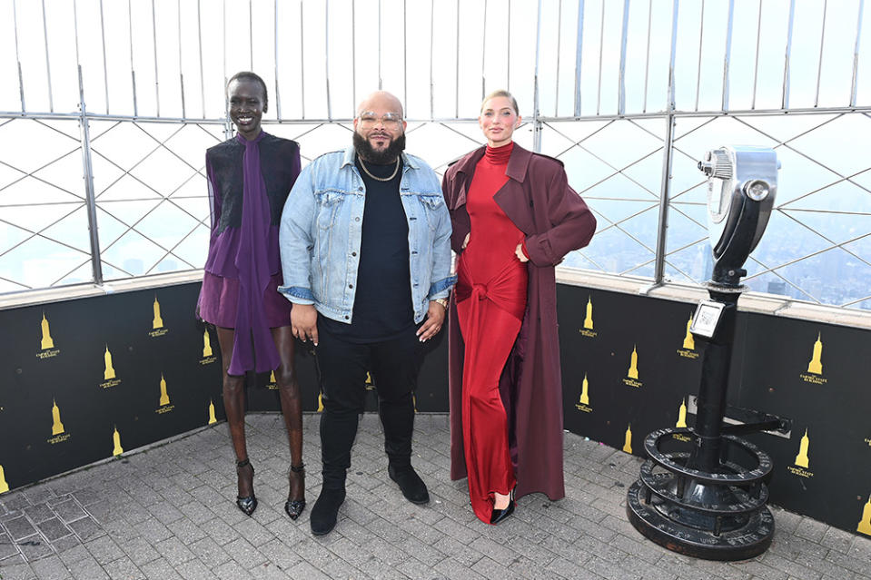 Alek Wek, Sergio Hudson and Elsa Hosk light The Empire State building in celebration of New York Fashion Week 2023 at The Empire State Building on September 08, 2023 in New York City.