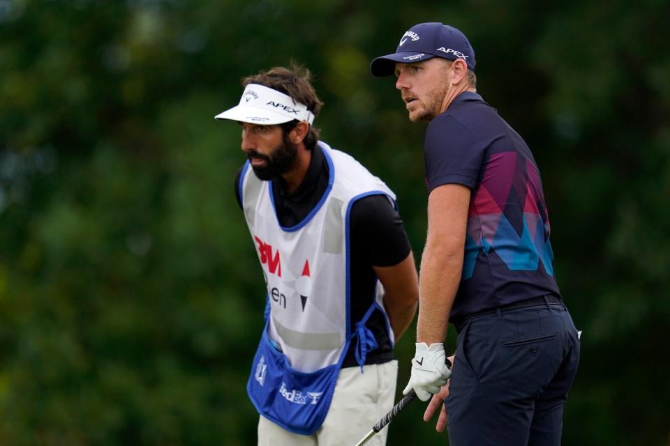 Matt Wallace talks with his caddie before his tee shot on the 10th hole during round three of the 3M Open (Abbie Parr/PA) (AP)