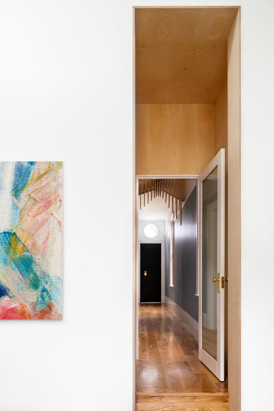 AFTER: The front hallway features skirting boards and and an elaborate ark tray.