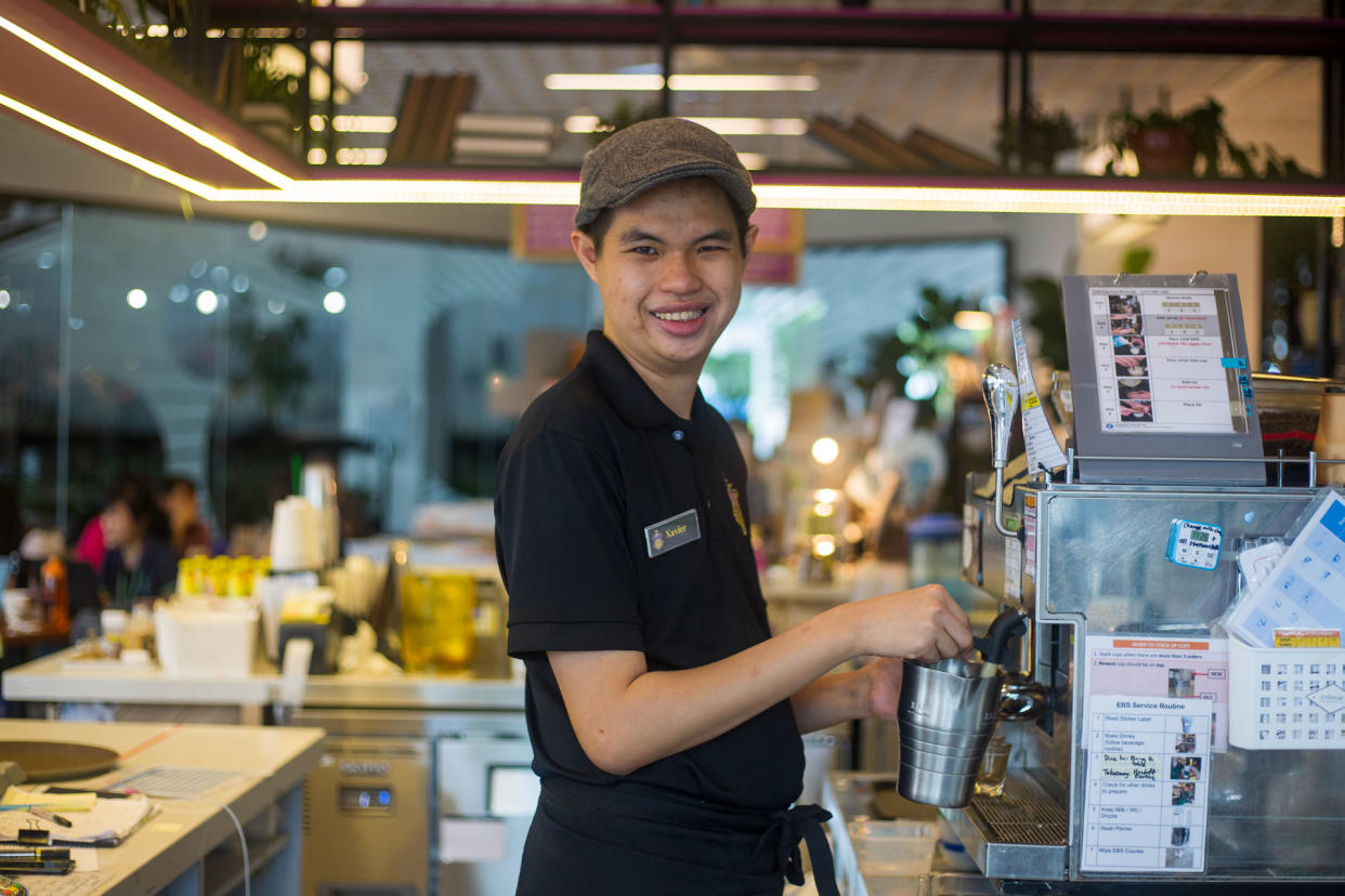 25-year-old cafe assistant Xavier Yap at Pathlight's Professor Brawn cafe. (PHOTO: Dhany Osman/Yahoo News Singapore)