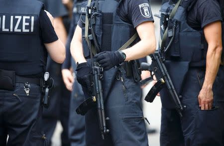 Special police stand outside the university clinic in Steglitz, a southwestern district of Berlin, July 26, 2016 after a doctor had been shot at and the gunman had killed himself. REUTERS/Hannibal Hanschke