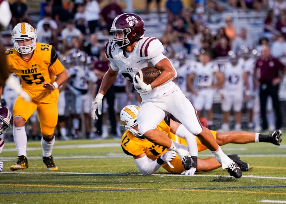 First Baptist Academy Lions running back Logan Bartley (24) turns upfield during the first quarter of a game against the Bishop Verot Vikings at Bishop Verot High School in Fort Myers on Friday, Sept. 15, 2023.