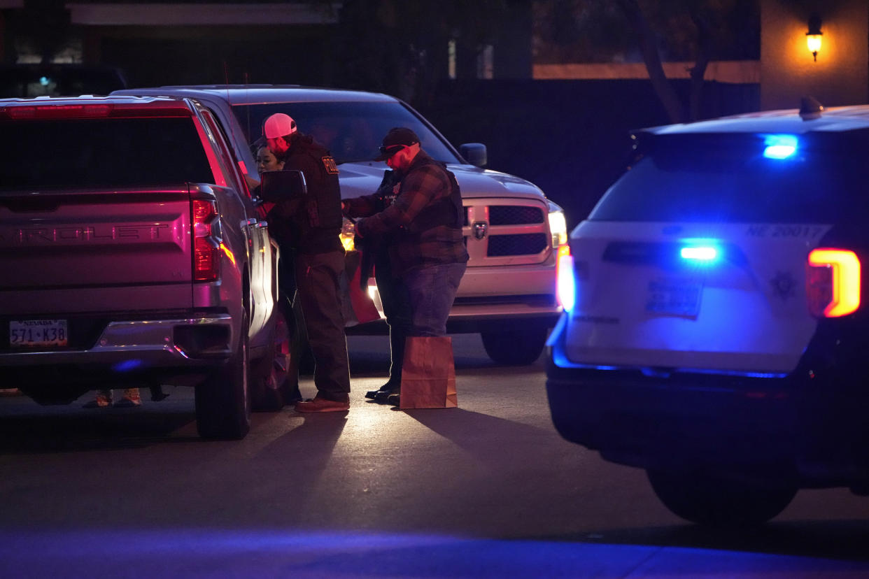 Las Vegas police work near the home of former actor Nathan Lee Chasing His Horse, who goes by Nathan Chasing Horse, Tuesday, Jan. 31, 2023, in North Las Vegas, Nev. (AP Photo/John Locher)