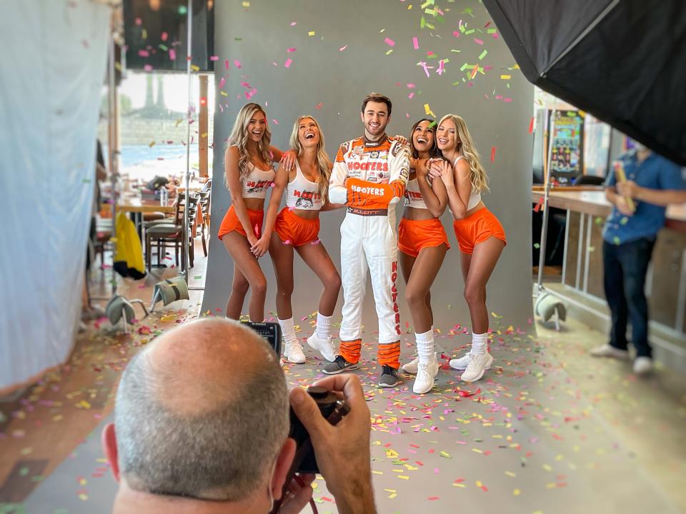 It's doubtful Chase Elliott ever injured himself during a photo shoot with his orange-themed restaurant sponsor.