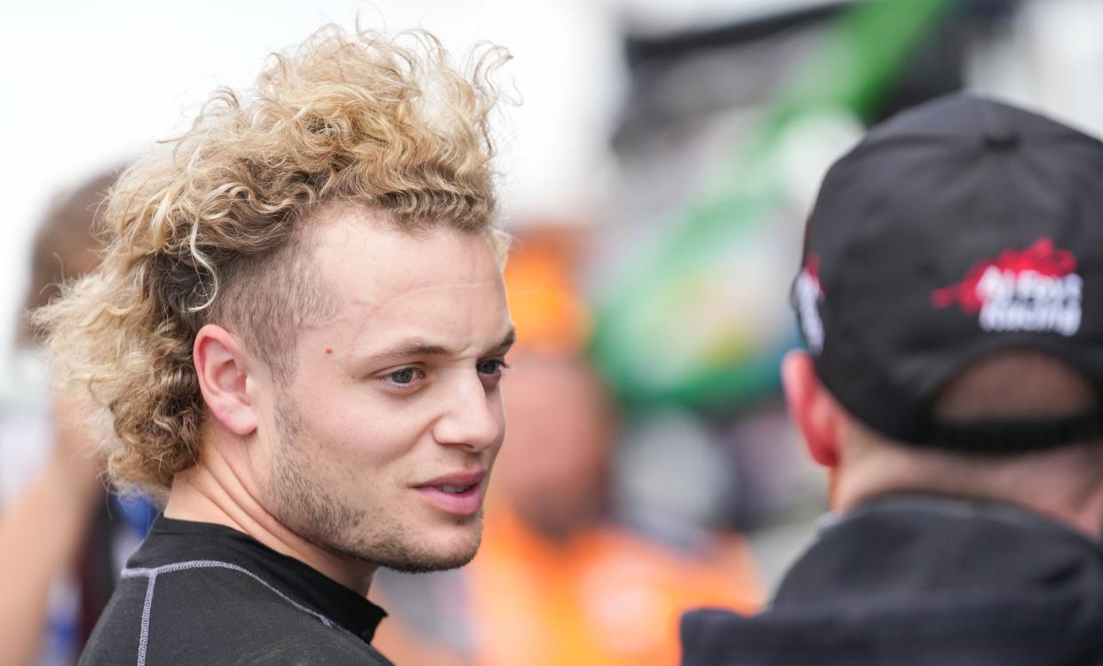 /dA.J. Foyt Enterprises driver Santino Ferrucci (14) talks with a racing engineer Friday, May 10, 2024, during practice for the Sonsio Grand Prix at Indianapolis Motor Speedway.