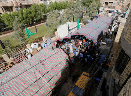 A general view of the site of a suicide bomb attack in the city's northern al-Shaab district in Baghdad, Iraq October 15, 2016. REUTERS/Ahmed Saad