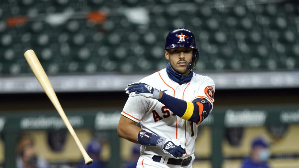 Houston Astros' Carlos Correa tosses his bat during the second inning of a baseball game against the Texas Rangers Tuesday, Sept. 15, 2020, in Houston. (AP Photo/David J. Phillip)