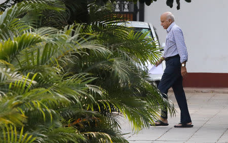 India's Minister of State for External Affairs Mobashar Jawed Akbar walks inside his residence in New Delhi, India October 14, 2018. REUTERS/Anushree Fadnavis