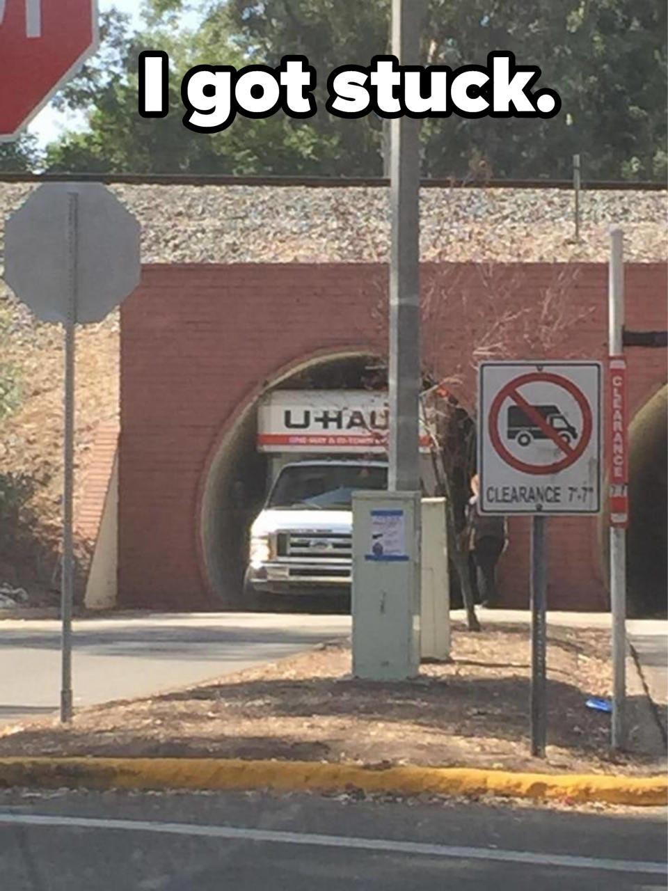 A U-Haul truck stuck in a tunnel with the caption "I got stuck"