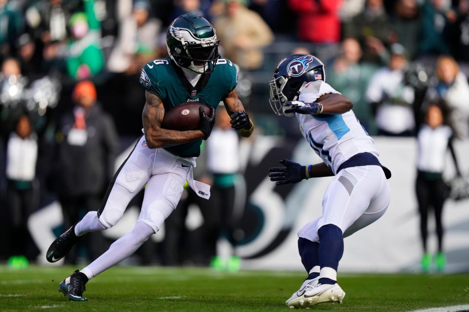 Philadelphia Eagles' DeVonta Smith runs with the ball for a touchdown during the first half of an NFL football game against the Tennessee Titans, Sunday, Dec. 4, 2022, in Philadelphia.