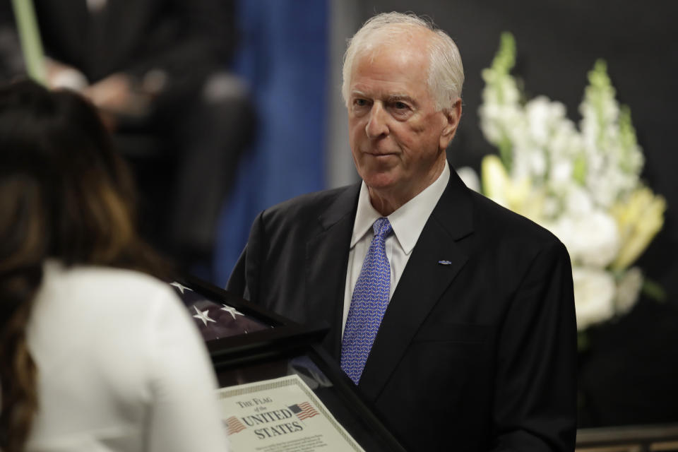 Rep. Mike Thompson, D-Calif., presents an American flag that has flown over the US Capitol to Angela Underwood Jacobs, sister of slain Federal Protective Services Officer Dave Patrick Underwood, during a memorial service for Underwood on Friday, June 19, 2020, in Pinole, Calif. Underwood was fatally shot as he was guarding the Ronald V. Dellums Federal Building in Oakland, Calif., amid protests on May 29. (AP Photo/Ben Margot)