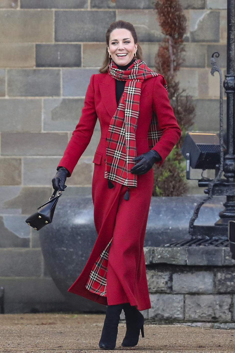 Britain's Kate Duchess of Cambridge at Cardiff Castle on Tuesday Dec. 8, 2020, in Cardiff, Wales. Prince William and Kate Duchess of Cambridge are undertaking a short tour of the UK by train ahead of the Christmas holidays to pay tribute to the inspiring work in local communities. (Chris Jackson/Pool via AP)