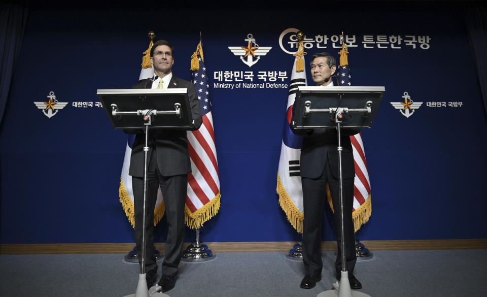 U.S. Defense Secretary Mark Esper, left, and South Korean Defense Minister Jeong Kyeong-doo, hold a joint press conference after the 51st Security Consultative Meeting (SCM) at the Defense Ministry in Seoul Friday, Nov. 15, 2019. U.S. Defense Secretary Esper says South Korea is wealthy enough to pay a bigger share of the cost of having U.S. troops on its soil. (Jung Yeon-je/Pool Photo via AP)