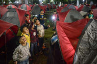 <p>Indonesian children look at the blood moon while waiting for a lunar eclipse at Salman Astro Camp in Bandung, Indonesia, July 28, 2018. (Photo: Antara Foto/Raisan Al Farisi via Reuters) </p>