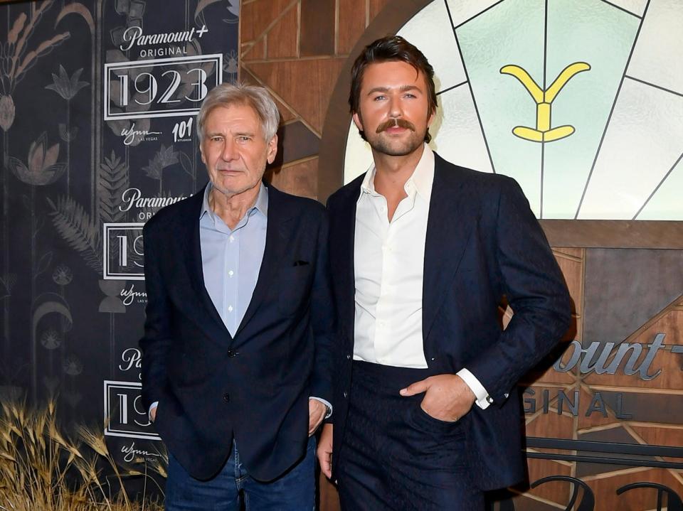 Harrison Ford and Brandon Sklenar attend Paramount+'s "1923" Las Vegas Premiere at the Encore Theater at Wynn Las Vegas on December 03, 2022 in Las Vegas, Nevada.