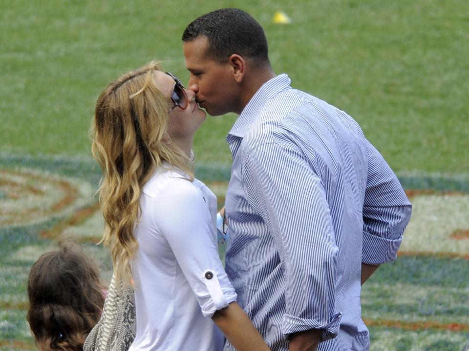 Alex Rodriguez and actress Kate Hudson kiss at Yankees Family Picnic Day July 25, 2009 in New York City