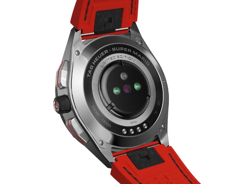 <p>Back view of the Tag Heuer Connected Limited Edition Super Mario with a red strap. Above the heart rate sensor are the words "Tag Heuer Super Mario LImited Edition."</p>
