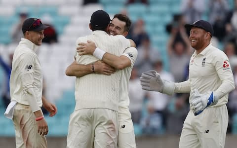 England's James Anderson (C) celebrates with England's Alastair Cook after taking the wicket of India's Mohammed Shami on the final day of the fifth Test cricket match between England and India at The Oval in London on September 11, 2018 - Credit: Getty images