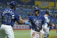 Tampa Bay Rays' Wander Franco celebrates with Randy Arozarena (56) after scoring on an RBI double by Brandon Lowe off New York Yankees pitcher Nestor Cortes during the fourth inning of a baseball game Wednesday, July 28, 2021, in St. Petersburg, Fla. (AP Photo/Chris O'Meara)