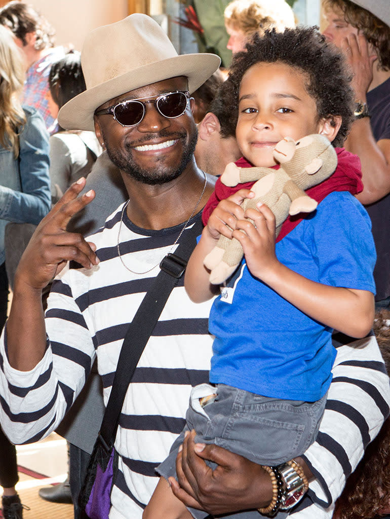 Taye Diggs and Walker at a movie premiere (Photo: Getty Images) .