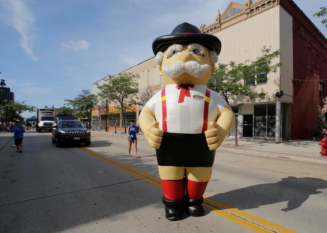 The Jaycees brat man marches during the Jaycees Brat Days parade, Saturday, August 6, 2022, in Sheboygan, Wis.