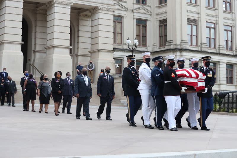 An honor guard carries the casket of late U.S. Congressman John Lewis in Atlanta