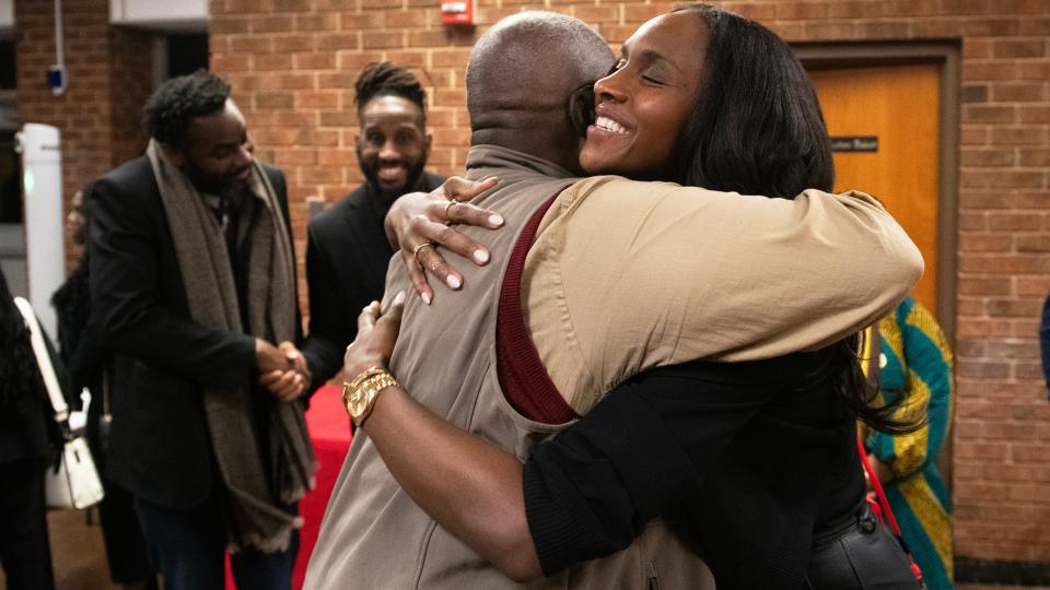 Crystal Langhorne, a Willingboro High School graduate and former WNBA player, right, hugs her former AAU basketball coach Dennis Tunstall prior to a ceremony held to celebrate the Willingboro High School gym being renamed after Langhorne on Wednesday, December 13, 2023.