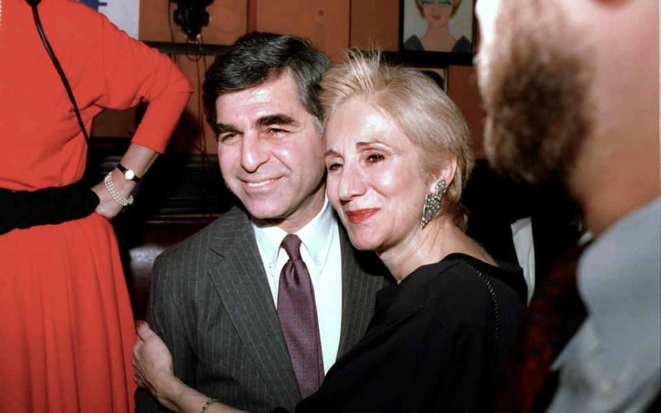 With her cousin, Michael, the governor of Massachusetts who unsuccessfully ran for president - AP