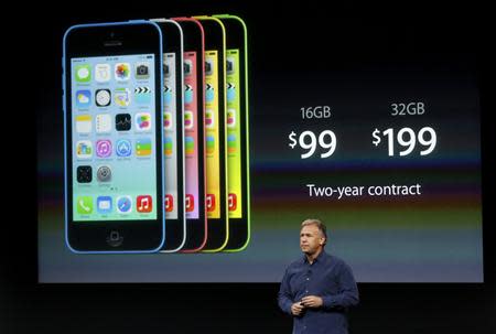 Phil Schiller, senior vice president of worldwide marketing for Apple Inc, talks about the pricing of the new iPhone 5C at Apple Inc's media event in Cupertino, California September 10, 2013. REUTERS/Stephen Lam