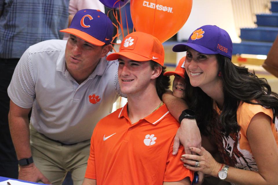 Bolles baseball pitcher Chayce Kieck gathers with parents Greg and Amanda and younger brother Landen after signing with Clemson.