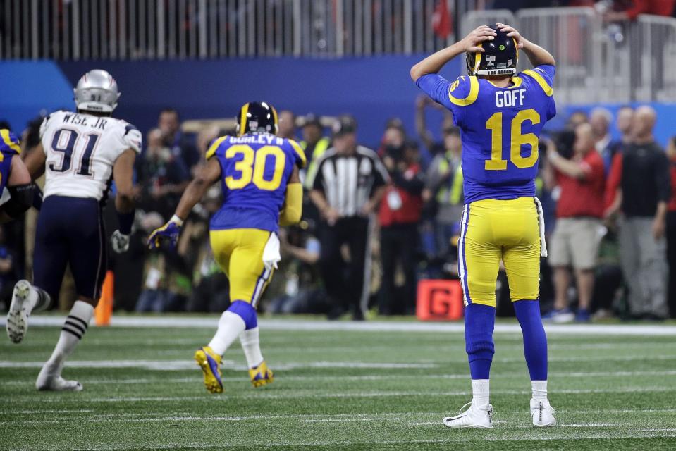 Los Angeles Rams' Jared Goff (16) reacts after throwing an interception caught by New England Patriots' Stephon Gilmore during the second half of the NFL Super Bowl 53 football game Sunday, Feb. 3, 2019, in Atlanta. (AP Photo/Patrick Semansky)