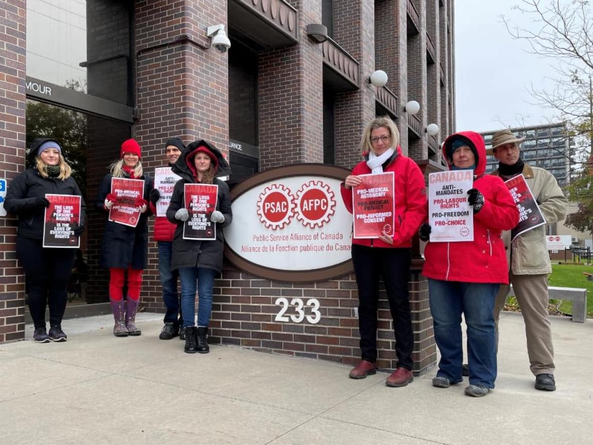 People protest outside the Public Service Alliance of Canada building in Ottawa on Oct. 25, 2021. They say unions aren't standing up for public sector workers after the federal government introduced a vaccine mandate for its employees. (Patrick Louiseize/CBC - image credit)