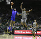 Baylor guard Mark Vital pressures the shot of Kansas guard Dajuan Harris, left, in the first half of an NCAA college basketball game, Monday, Jan. 18, 2021, in Waco, Texas. (Rod Aydelotte/Waco Tribune-Herald via AP)