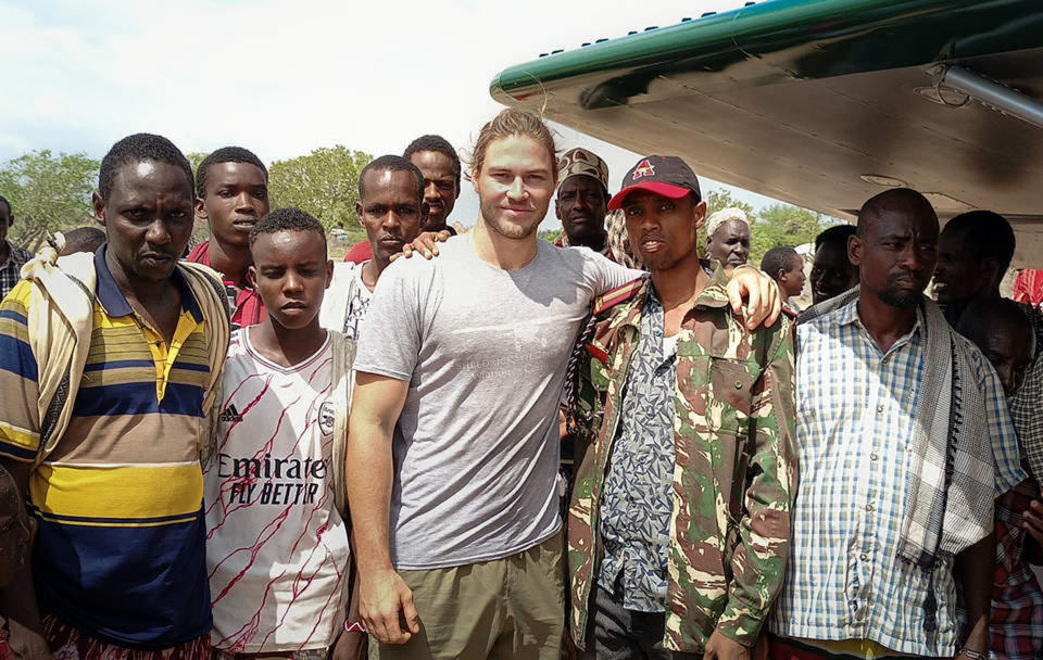 Carr-Hartley poses with several of the men who searched for Ayub for days. (Courtesy Sheldrick Wildlife Trust)