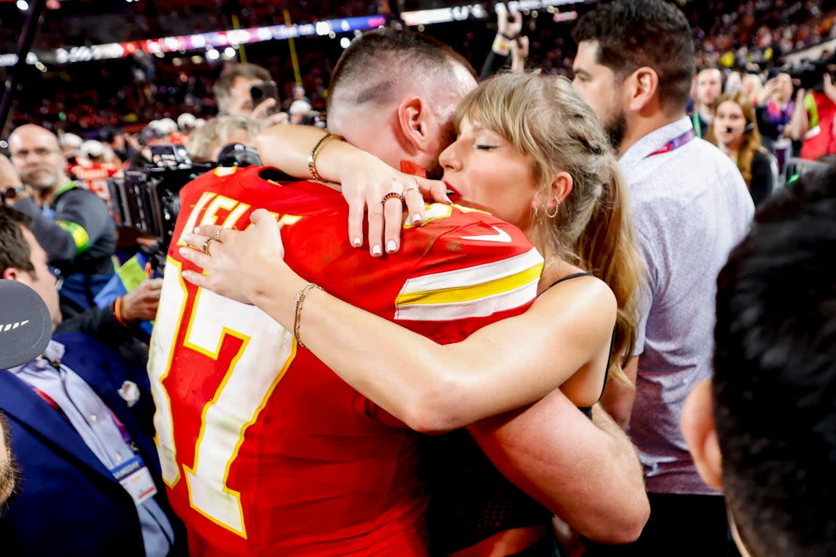 Travis Kelce and Taylor Swift embrace after the Super Bowl (EPA)