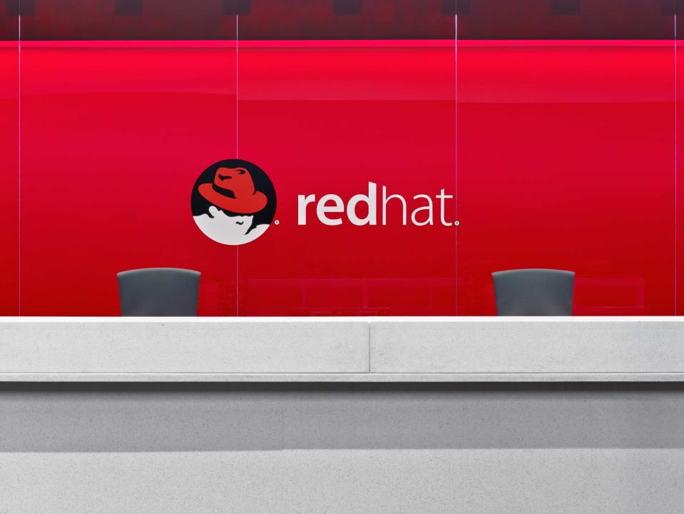 The Red Hat logo on a wall.