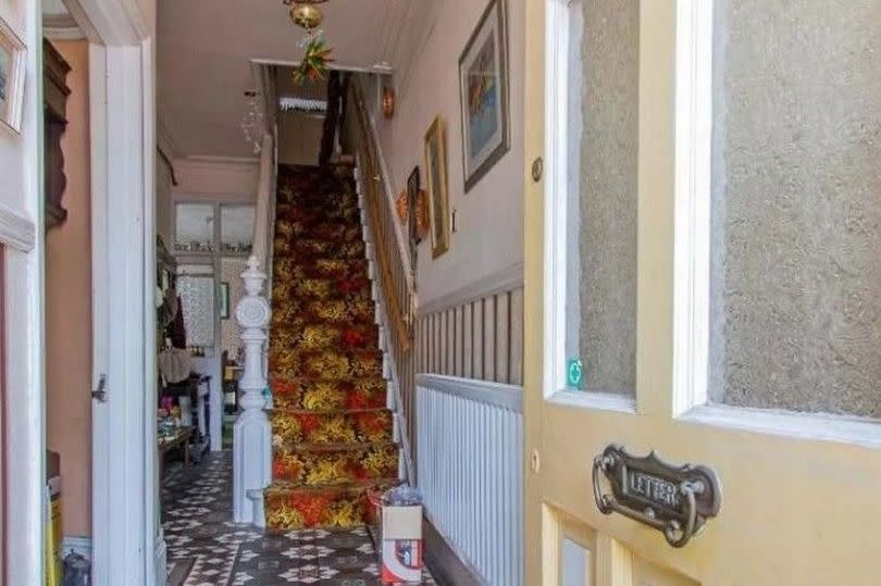 BEFORE: A mix of eras in this well-loved home - original Edwardian features and carpet and light from the 1970s