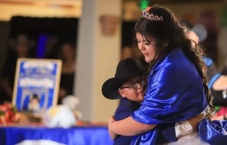 Memo hugs Karina closely as they dance to the song “You’ve Got a Friend In Me” during her quinceañera celebration.