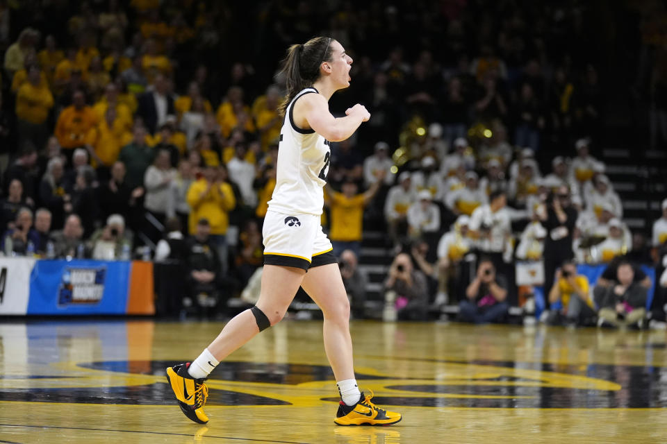 Iowa guard Caitlin Clark celebrates in the second half of a second-round college basketball game against West Virginia in the NCAA Tournament, Monday, March 25, 2024, in Iowa City, Iowa. Iowa won 64-54. (AP Photo/Charlie Neibergall)