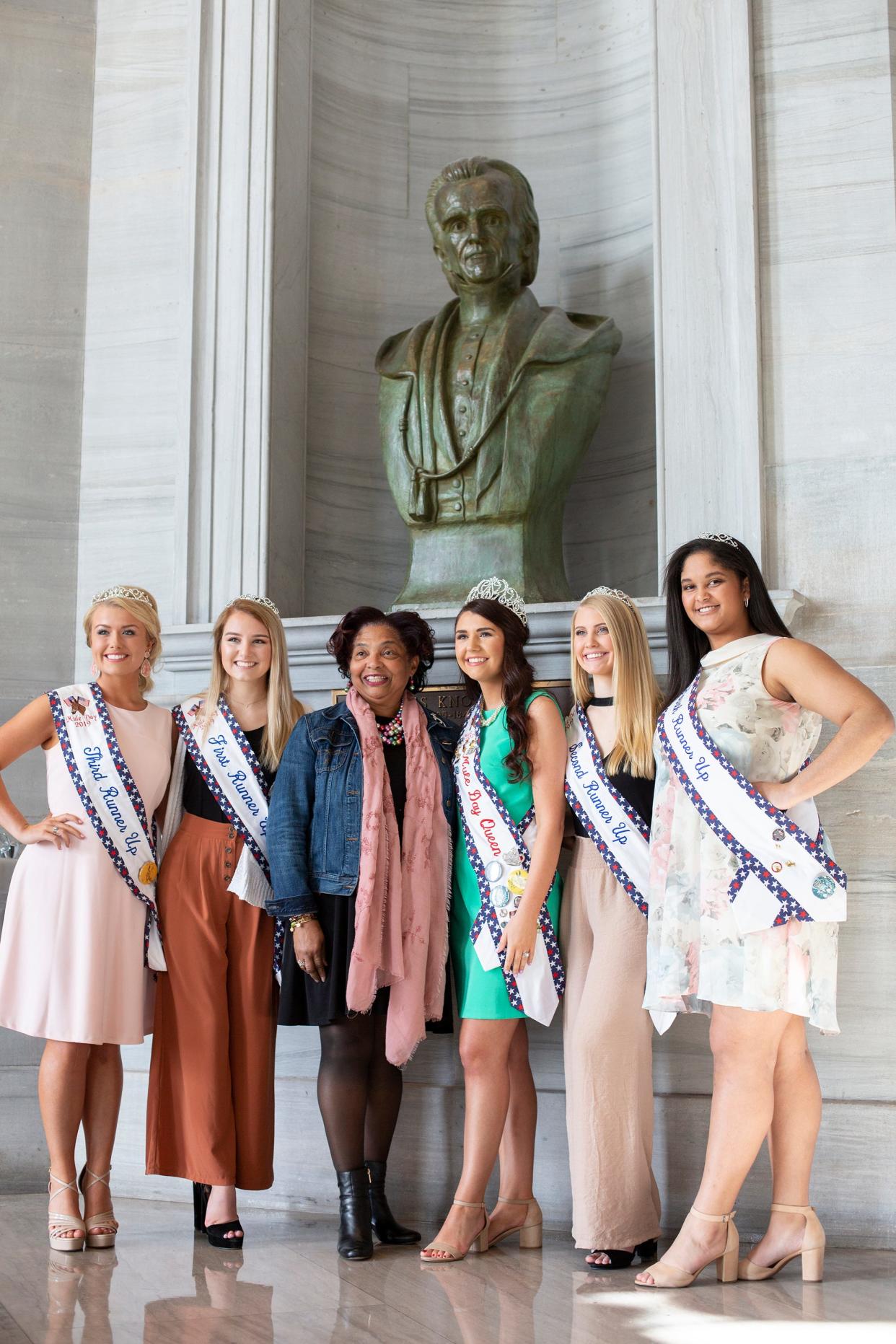Columbia Vice Mayor Christa Martin joins Mule Day queen Alayna Keeling and court members Hallie Marshall, 17;  Haley James, 18; Kayla Gibson, 18; and Graciee English, 16 in front of a bust of President James K. Polk at the Capitol Monday, April 1, 2019.