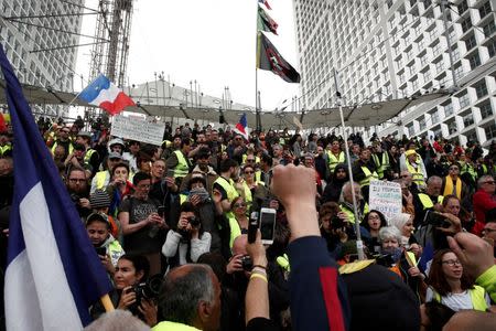 FILE PHOTO: Protesters wearing yellow vests attend a demonstration at the financial district of La Defense in Paris, France, April 6, 2019. REUTERS/Benoit Tessier/File Photo
