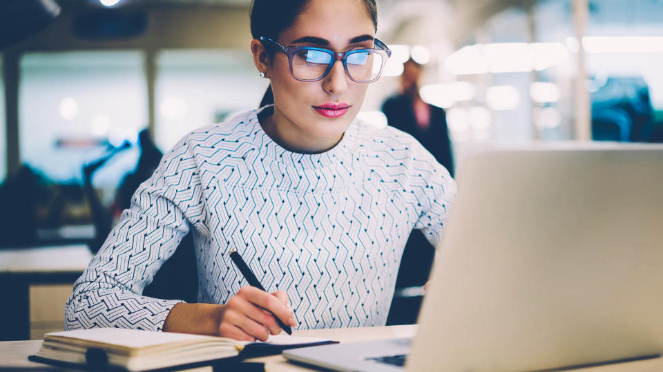 female student working in library