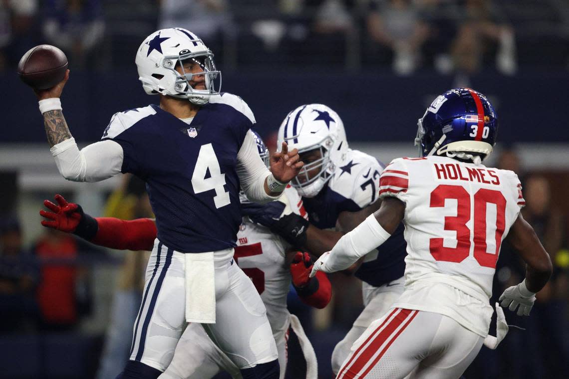 Dallas Cowboys quarterback Dak Prescott throws the ball during the first half against the New York Giants at AT&T Stadium in Arlington on Thursday, Nov. 24, 2022.