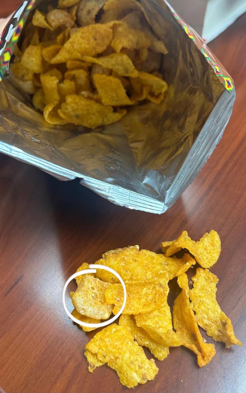 In this photo from Deka Trading, the circle shows the pork rind among the fried corn chips.